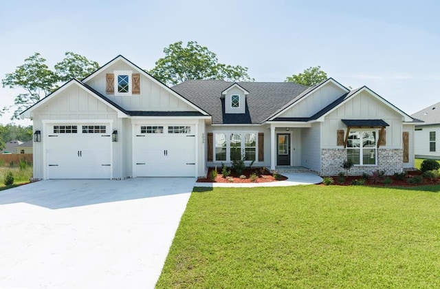 5039 Hatfield Cir, Hahira, GA 31632 - view of front of property featuring board and batten siding, an attached garage, driveway, a front lawn, and brick siding
