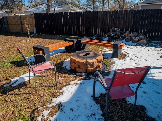 view of yard with a fire pit