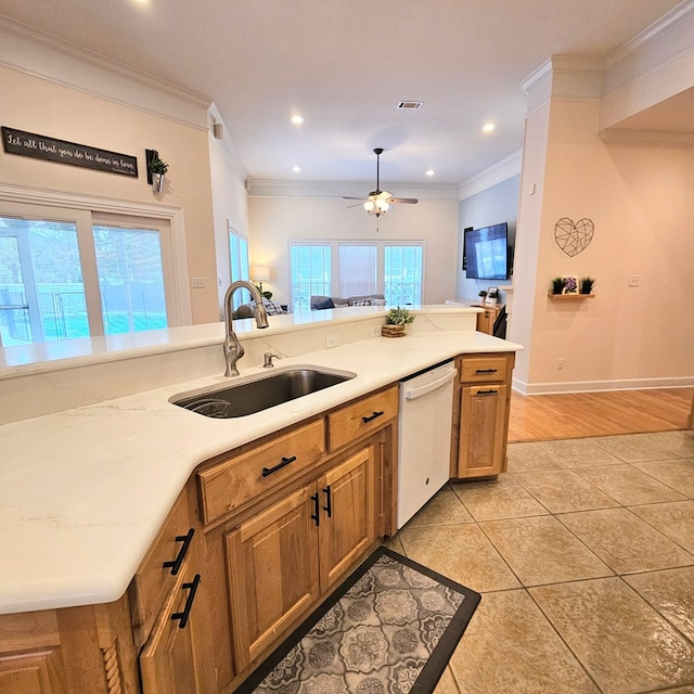 kitchen featuring sink, light tile patterned floors, ceiling fan, white dishwasher, and crown molding