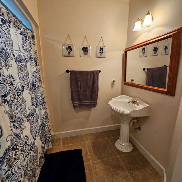 bedroom featuring ornamental molding, ceiling fan, dark carpet, and a tray ceiling