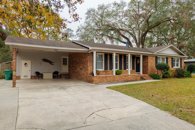 ranch-style house with a carport and a front yard