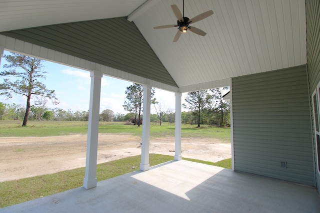 view of patio / terrace with ceiling fan and a view of rural / pastoral area