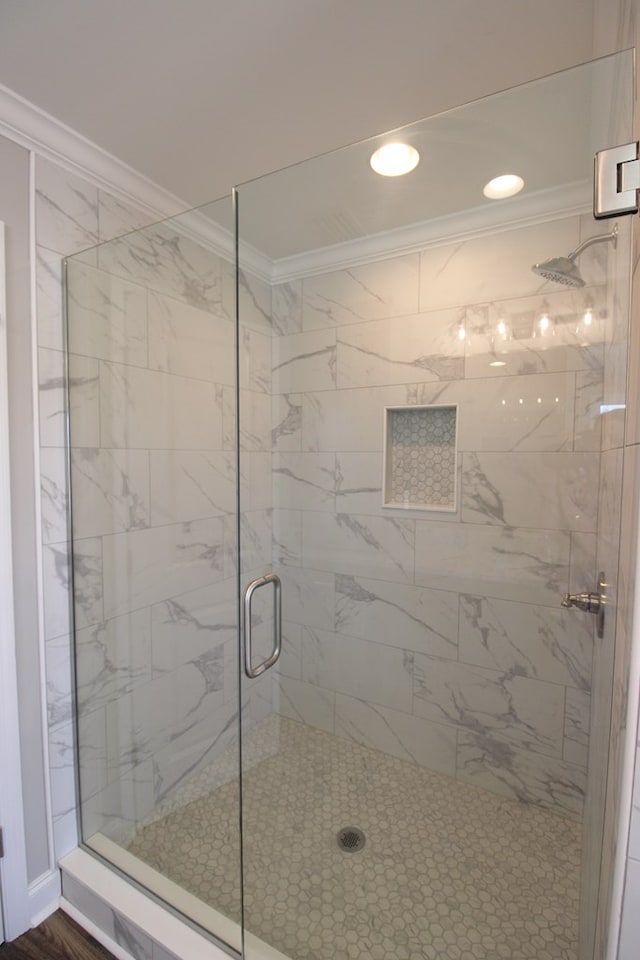 full bathroom with crown molding, a stall shower, and recessed lighting