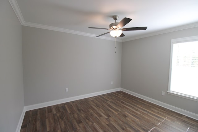 unfurnished room featuring plenty of natural light, a ceiling fan, dark wood-style floors, ornamental molding, and baseboards