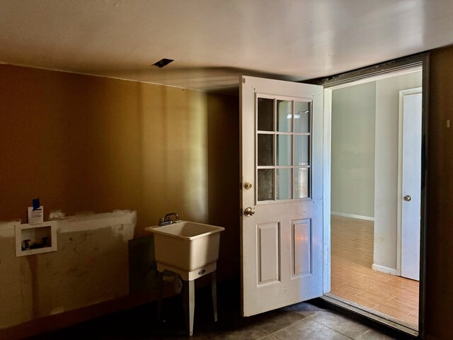 11 Crestwood Cir, Valdosta, GA 31602 - doorway featuring dark tile patterned floors and a sink