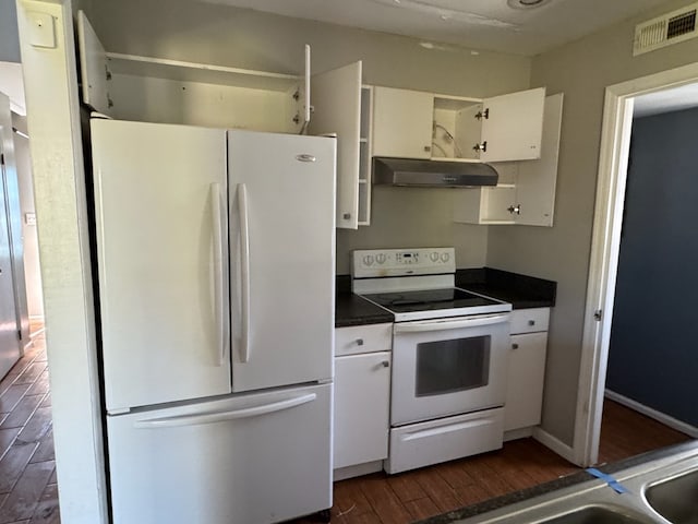 11 Crestwood Cir, Valdosta, GA 31602 - kitchen featuring white appliances, under cabinet range hood, dark wood-style floors, and white cabinetry