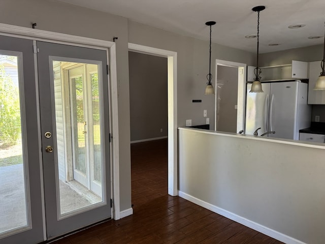 11 Crestwood Cir, Valdosta, GA 31602 - kitchen with freestanding refrigerator, plenty of natural light, baseboards, and dark wood finished floors