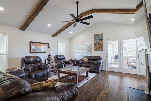 living room with lofted ceiling with beams, ceiling fan, and dark wood-type flooring