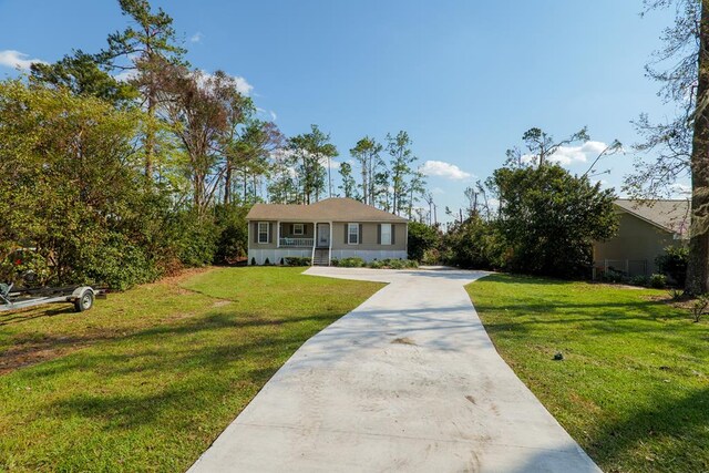 ranch-style house featuring a front lawn