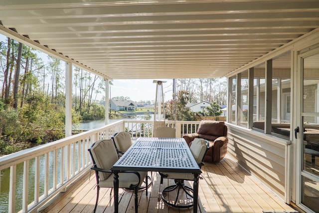 wooden deck featuring a water view