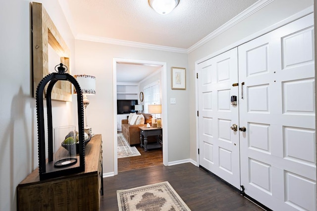 2202 Gornto Rd, Valdosta, GA 31602 - entrance foyer featuring ornamental molding, dark wood-style floors, a textured ceiling, and baseboards