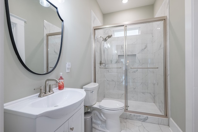 bathroom with vanity, toilet, and walk in shower