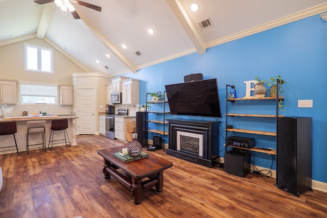 living room with dark hardwood / wood-style floors, high vaulted ceiling, beamed ceiling, ceiling fan, and crown molding