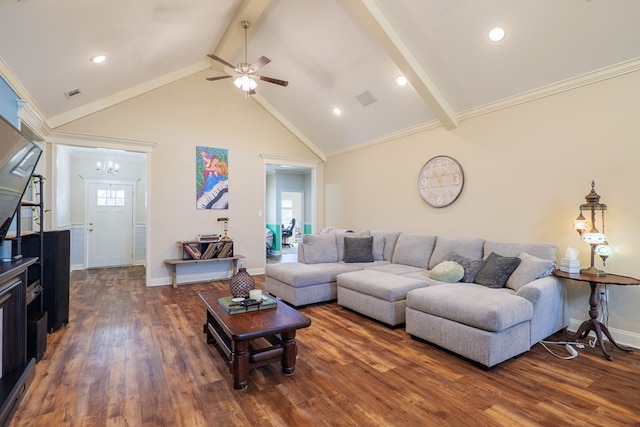 living room with lofted ceiling with beams, crown molding, a healthy amount of sunlight, and dark hardwood / wood-style flooring