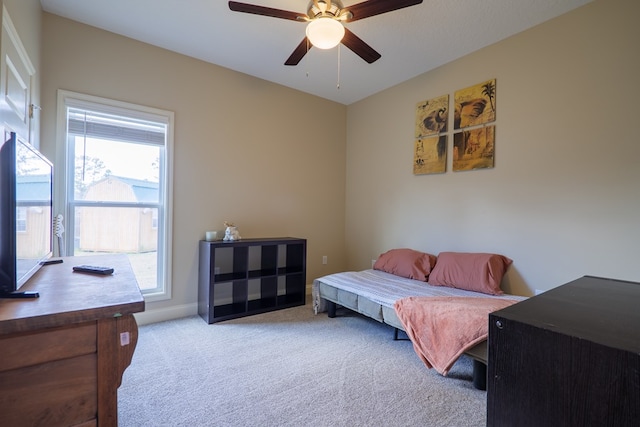 bedroom featuring ceiling fan and light carpet