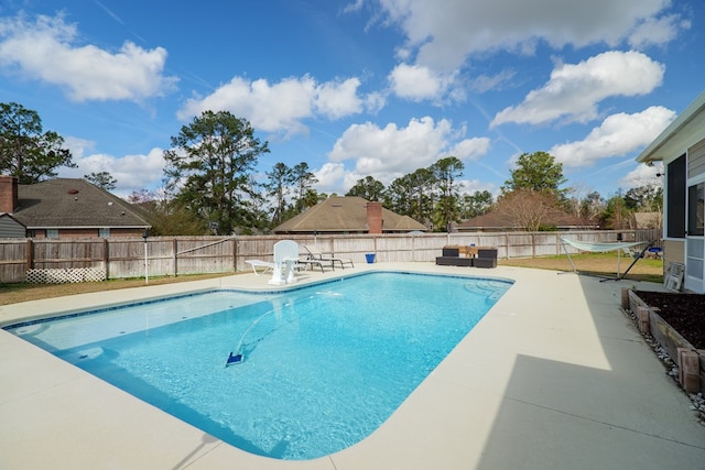 view of swimming pool with a patio area