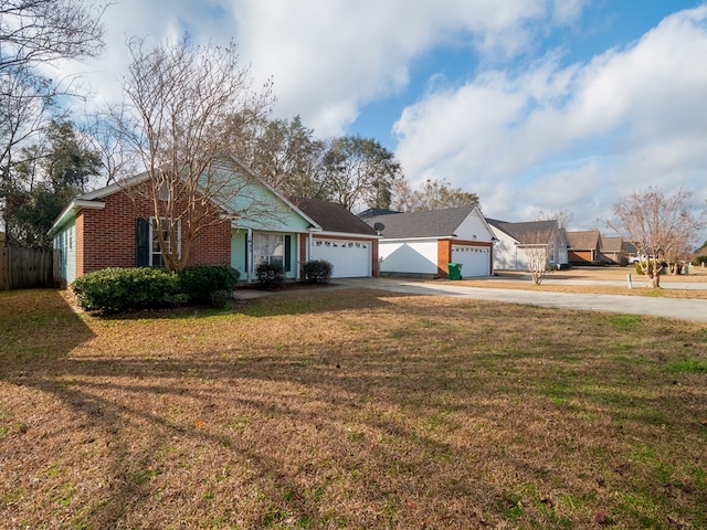 single story home with a garage and a front yard