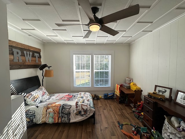 bedroom with dark hardwood / wood-style flooring and ceiling fan