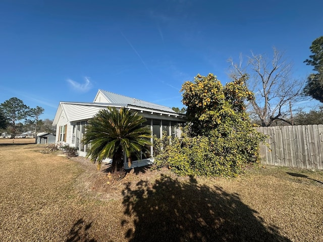 view of side of property featuring a yard