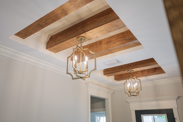 details featuring a raised ceiling, ornamental molding, a notable chandelier, and beam ceiling