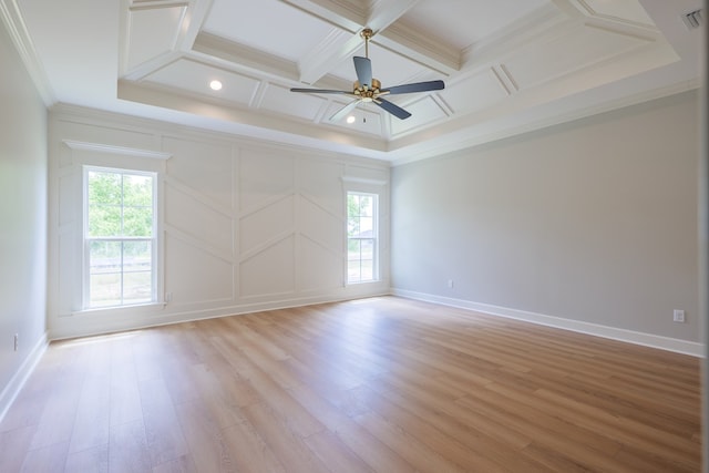 unfurnished room with beamed ceiling, coffered ceiling, ceiling fan, crown molding, and light hardwood / wood-style flooring