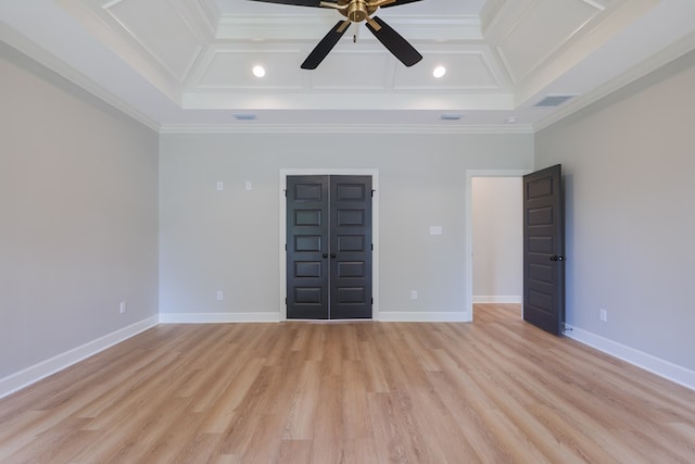 unfurnished bedroom with coffered ceiling, ornamental molding, and light hardwood / wood-style floors