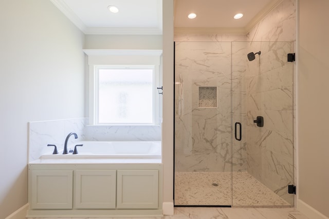 bathroom featuring crown molding and separate shower and tub