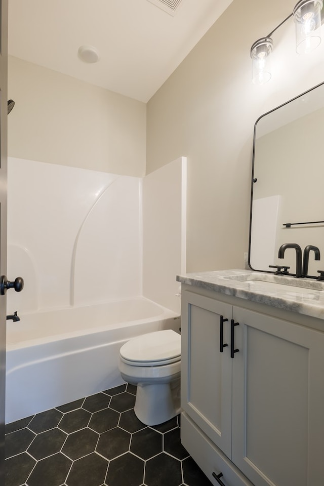 full bathroom with vanity, tile patterned floors, tub / shower combination, and toilet