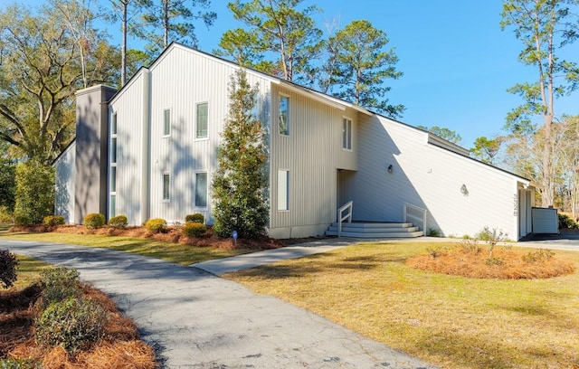 view of home's exterior with a yard