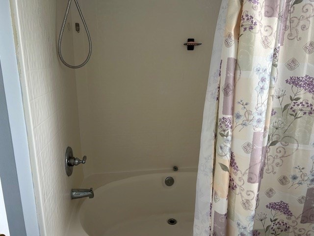 bathroom featuring shower / bath combination with curtain