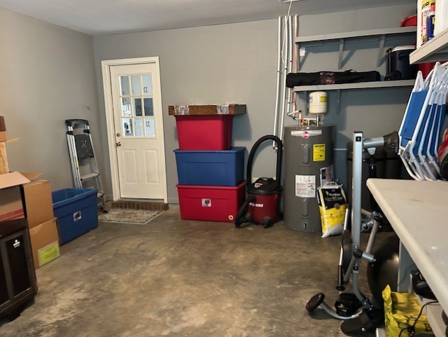 utility room featuring water heater