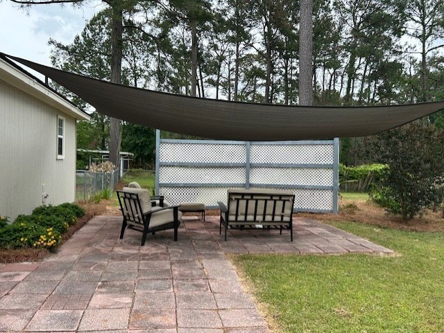 view of patio / terrace with fence and an outdoor living space