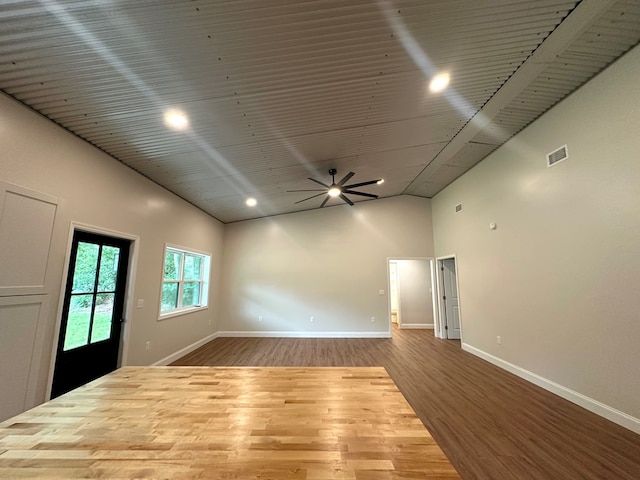 804 S Forrest Ave, Adel, GA 31620 - empty room featuring wood finished floors, high vaulted ceiling, and a ceiling fan