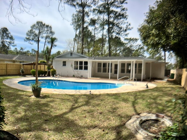 view of swimming pool with a lawn and a patio