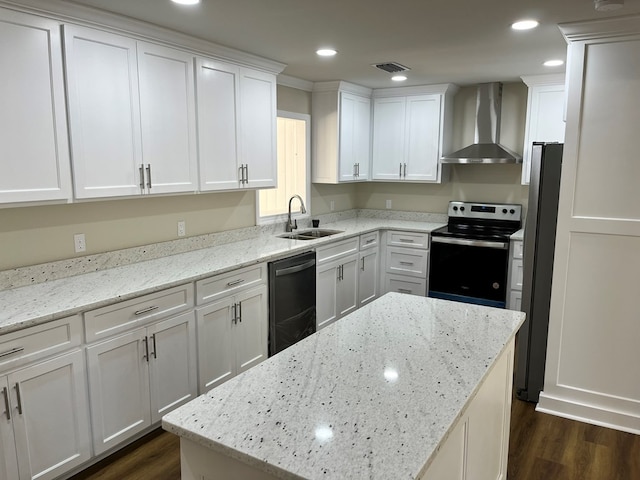 kitchen with light stone countertops, sink, dishwasher, wall chimney exhaust hood, and stainless steel range with electric cooktop