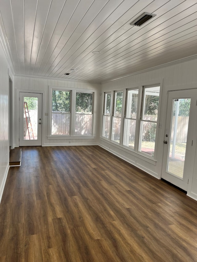 unfurnished sunroom with wood ceiling