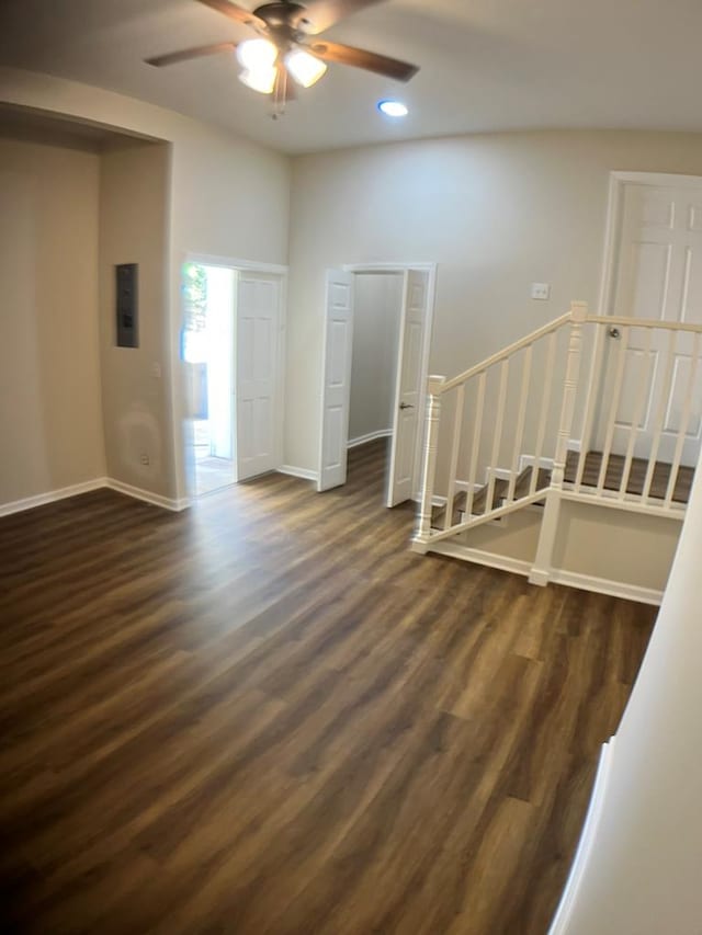 empty room featuring ceiling fan and dark wood-type flooring