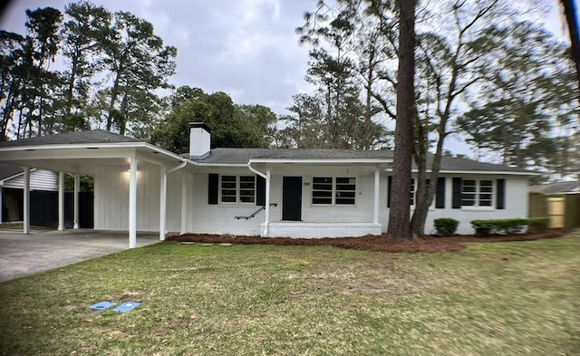 single story home featuring a carport and a front yard