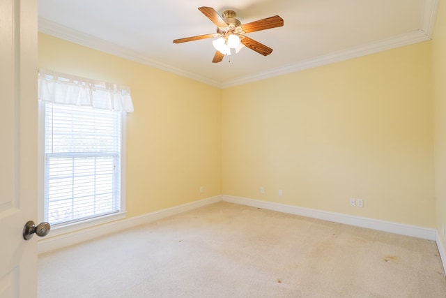 unfurnished room with light carpet, crown molding, baseboards, and ceiling fan