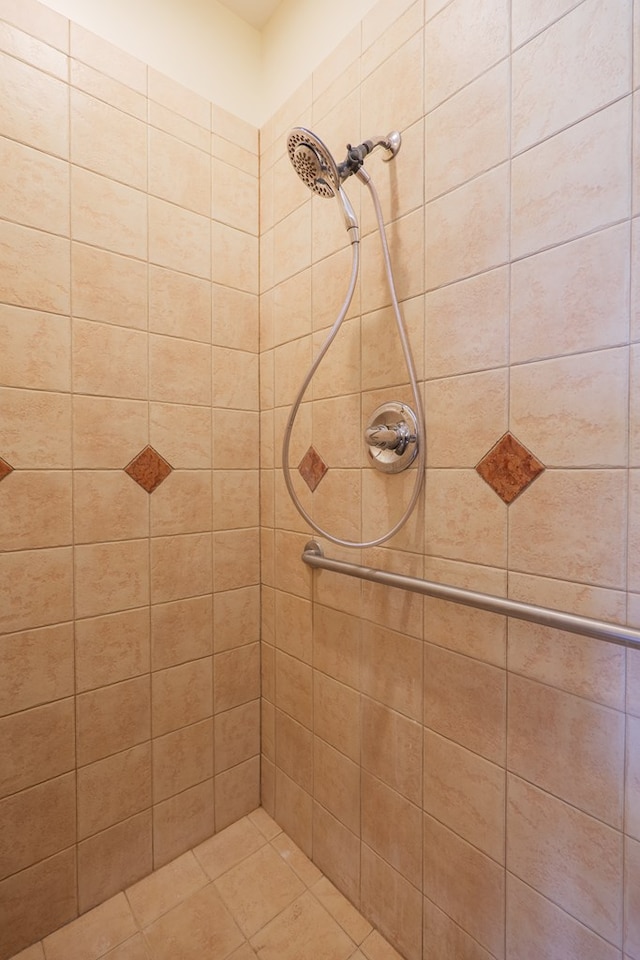 bathroom with tiled shower