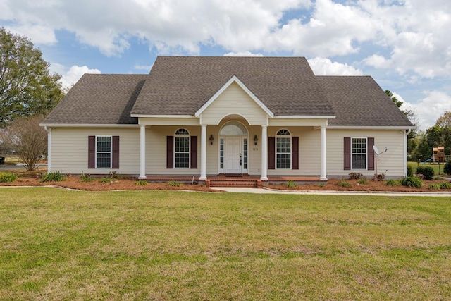 view of front of property featuring covered porch, a front lawn, and roof with shingles