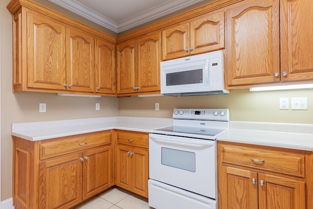 kitchen with white appliances, light countertops, crown molding, and light tile patterned floors