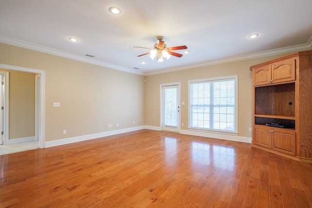 unfurnished living room featuring light wood-style floors, baseboards, ornamental molding, and recessed lighting