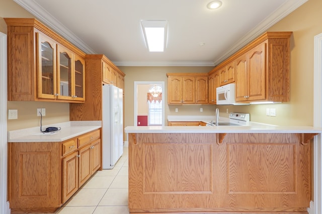 kitchen with light tile patterned floors, a peninsula, white appliances, glass insert cabinets, and crown molding