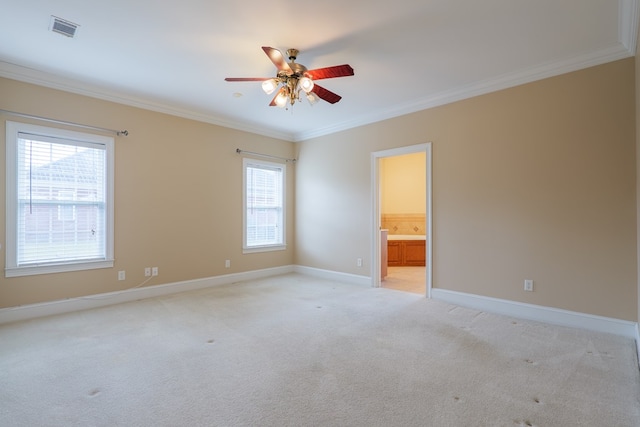 unfurnished room with light carpet, baseboards, visible vents, and crown molding