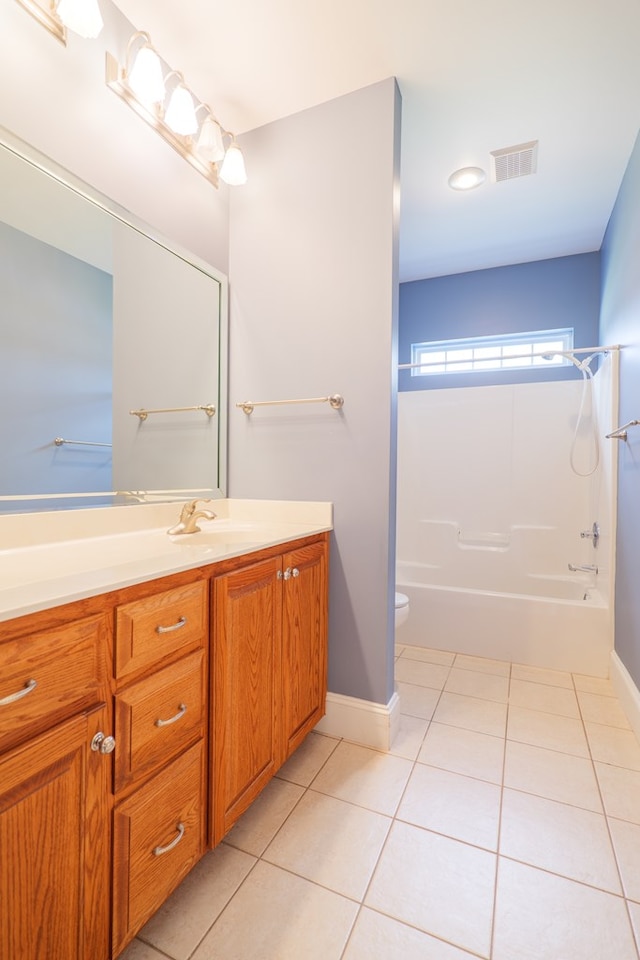 full bath with toilet, vanity, visible vents, and tile patterned floors