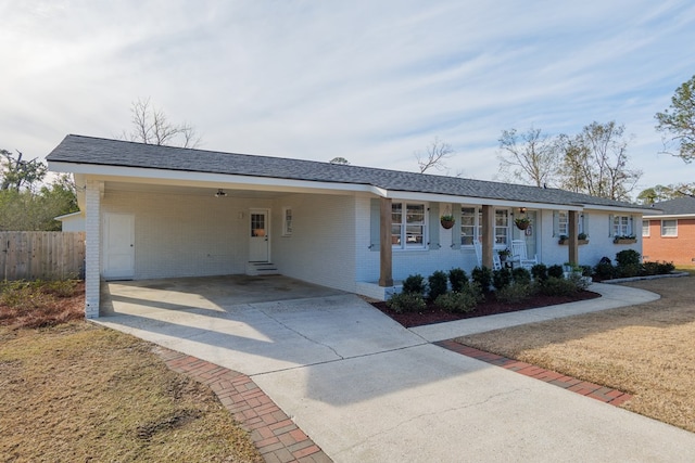 single story home featuring a carport