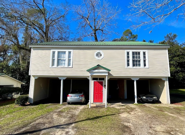 view of front of property with a carport