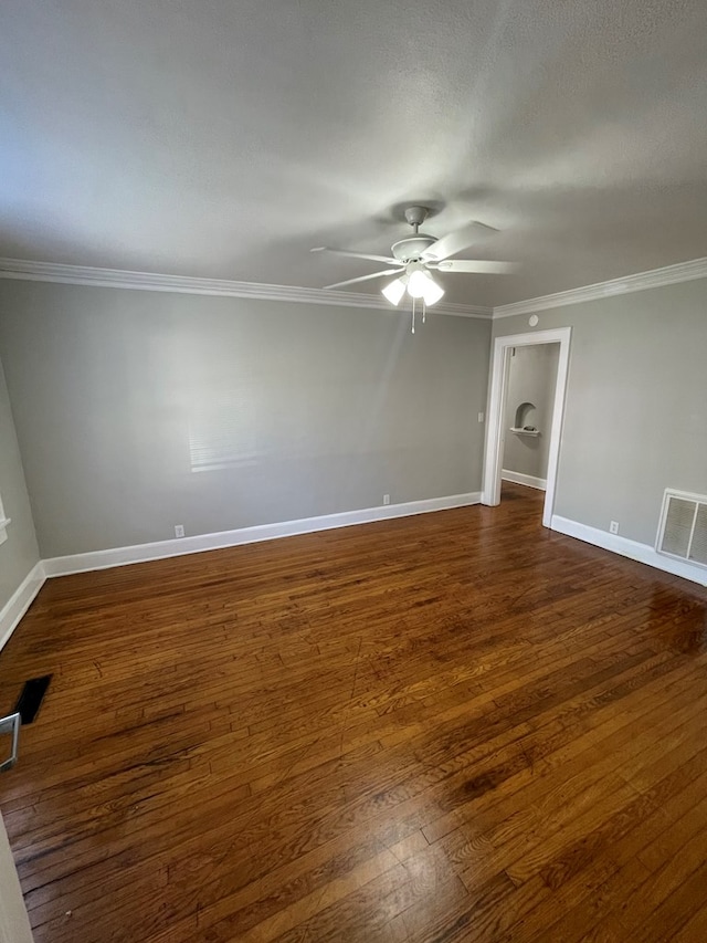 unfurnished room with a textured ceiling, dark hardwood / wood-style floors, ceiling fan, and crown molding