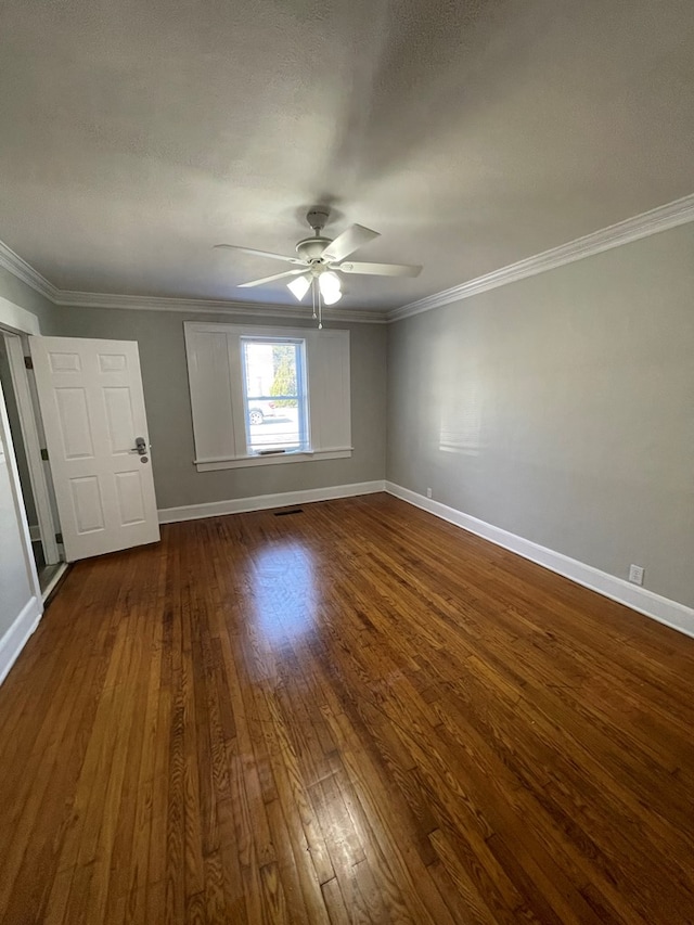 spare room featuring ceiling fan, hardwood / wood-style floors, a textured ceiling, and ornamental molding